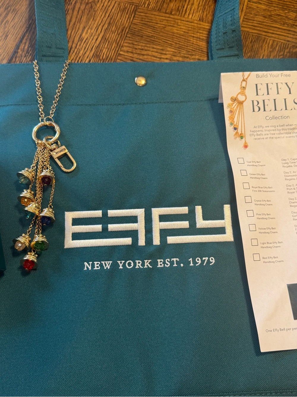 Effy Teal Canvas Logo Tote with Gold color bag charm with 8 Effy bell charms. - Picture 6 of 6